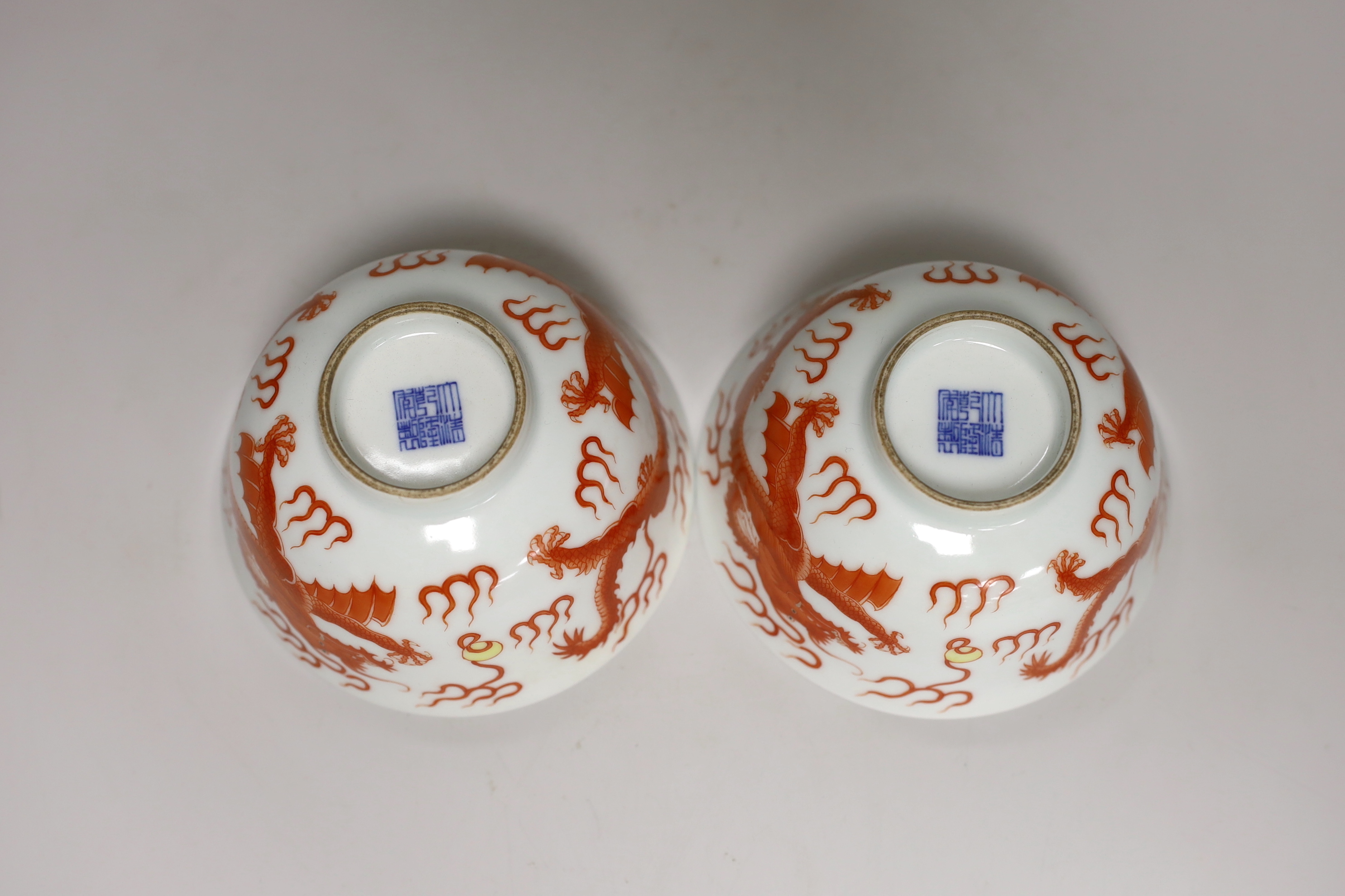 A pair of Chinese iron-red decorated ‘dragon’ bowls (bowed) bowls 6.5cm high